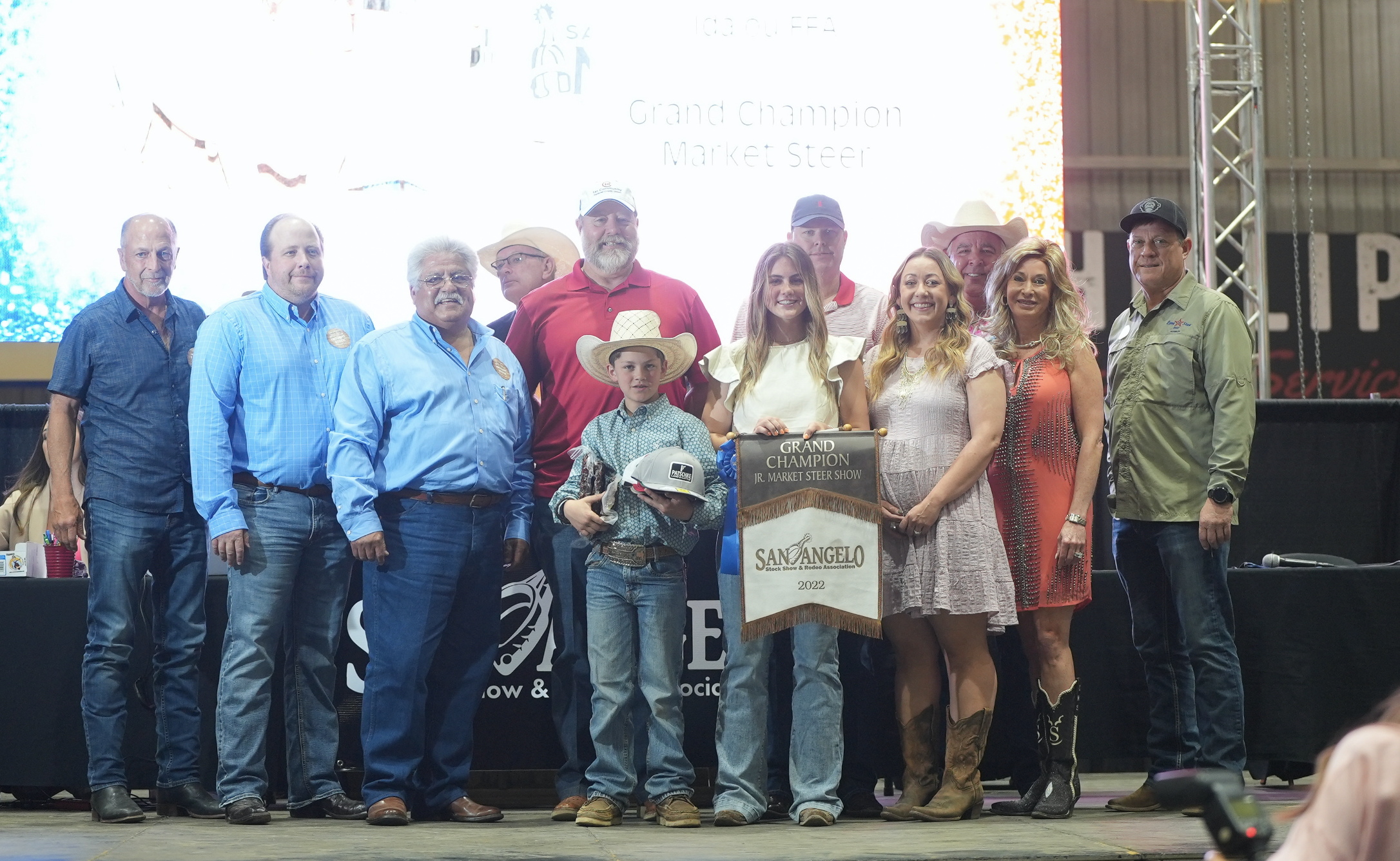 Aniston Patschke, Idalou FFA, Grand Champion Steer Along with Group of Buyers