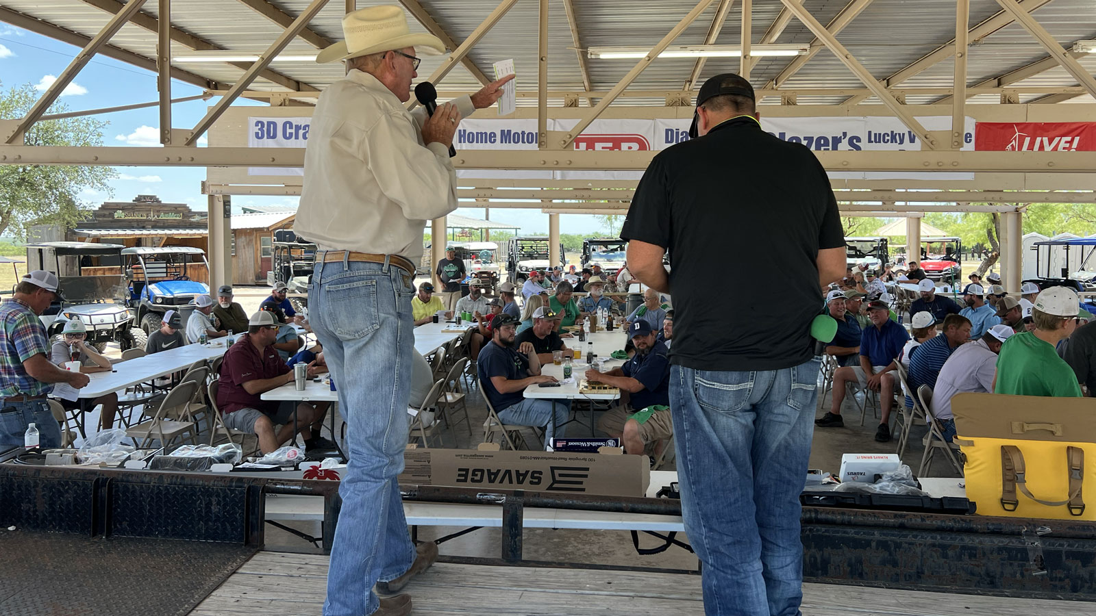 Auctioneer Bill Smith raises money for the Wall ISD baseball field lights on June 18, 2022