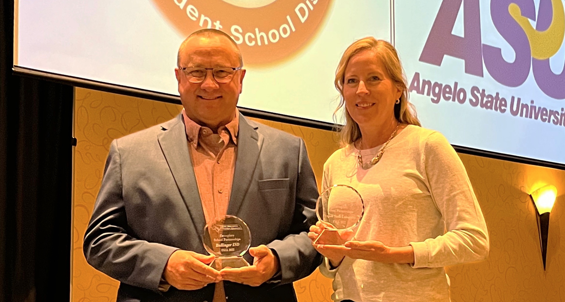 Ballinger ISD Superintendent Jeff Butts and ASU's Dr. Scarlet Clouse with their TxATE awards
