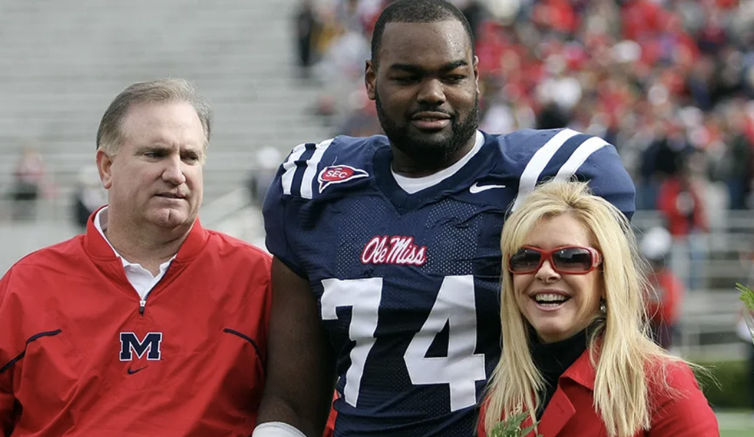 Michael Oher with Sean and Leigh Ann Tuohy