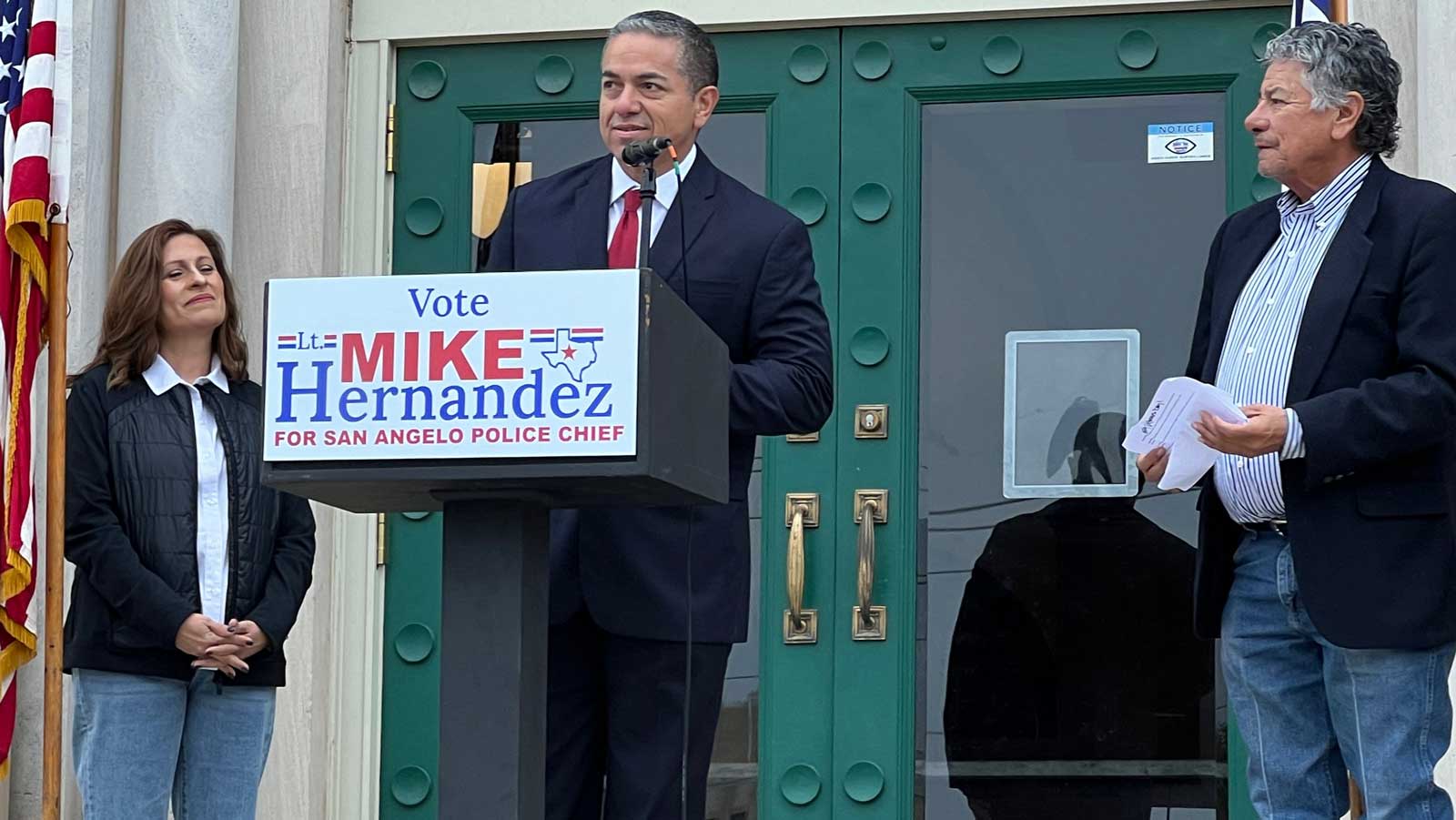 Mike Hernandez (center) flanked by his wife, Lisa, and his campaign manager Del Velasquez.