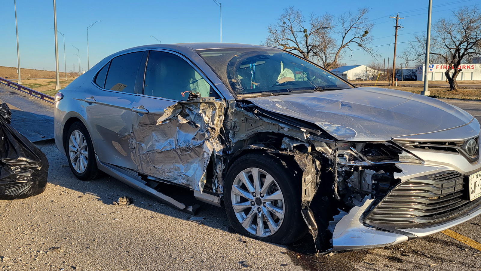 Mangled metal at the intersection of FM 2105 and US 87 N