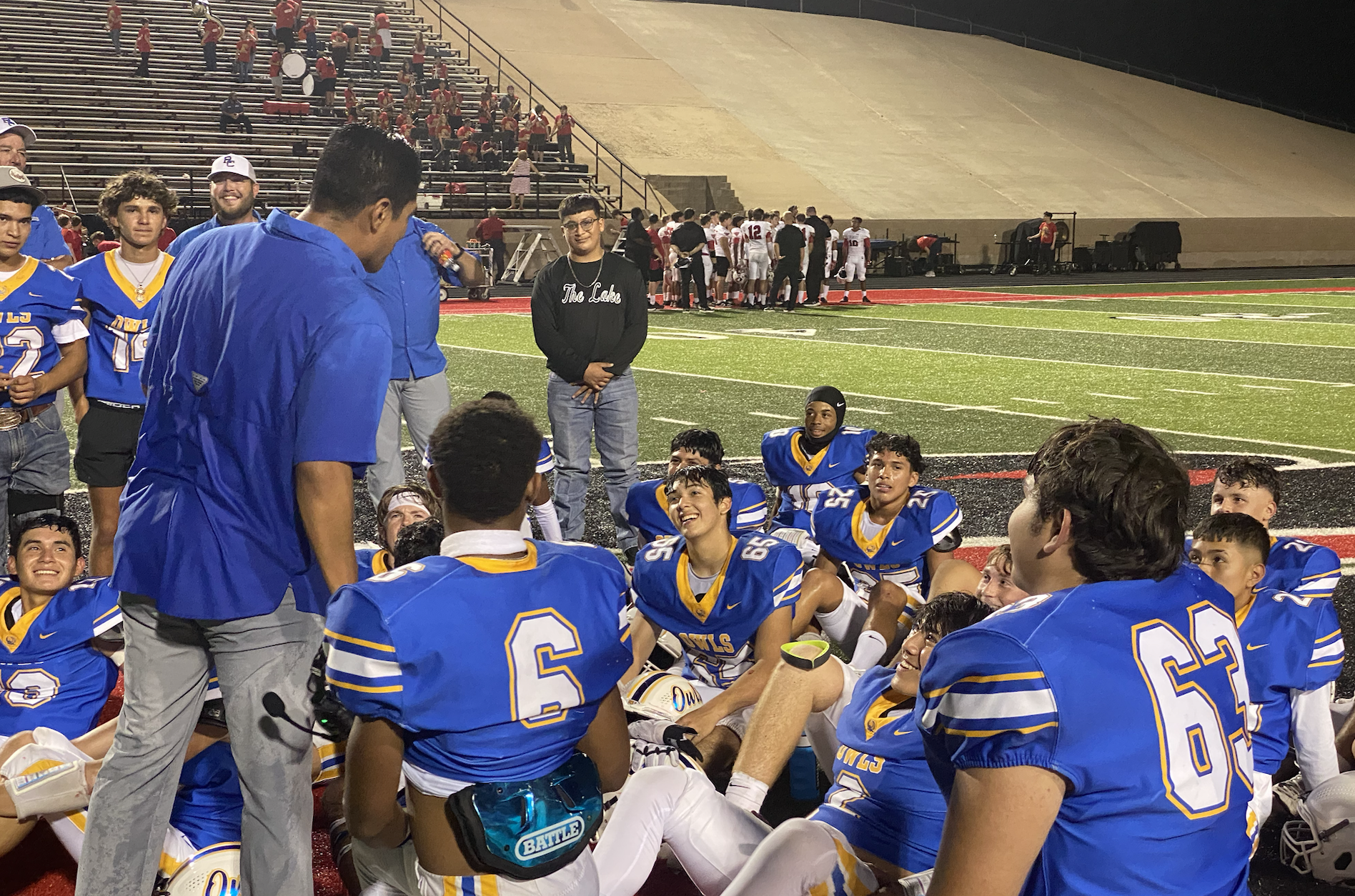 Owls defensive coordinator Willie Rangel addresses the team after a 32-0 win over the Olney Cubs.