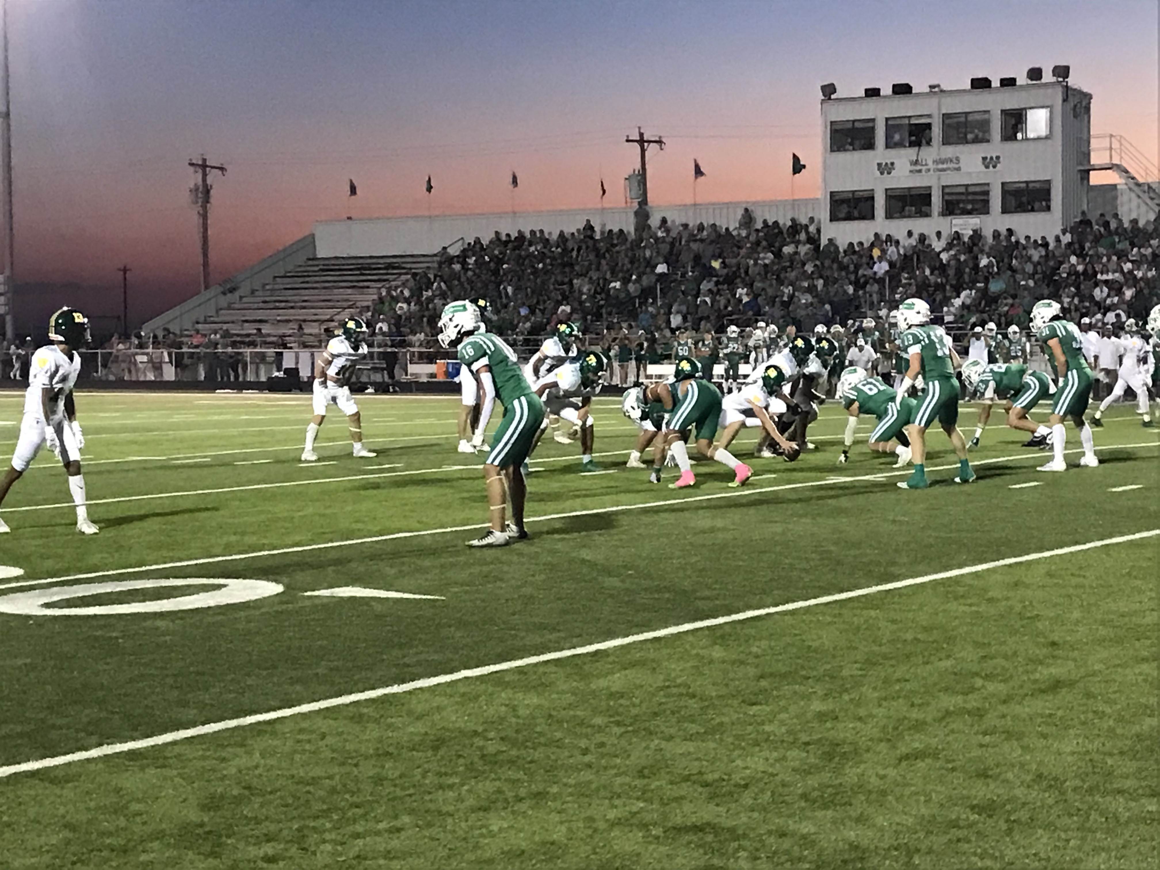 The Wall Hawks' defense prepares for the snap against Idalou on Friday, Oct. 4, 2024.