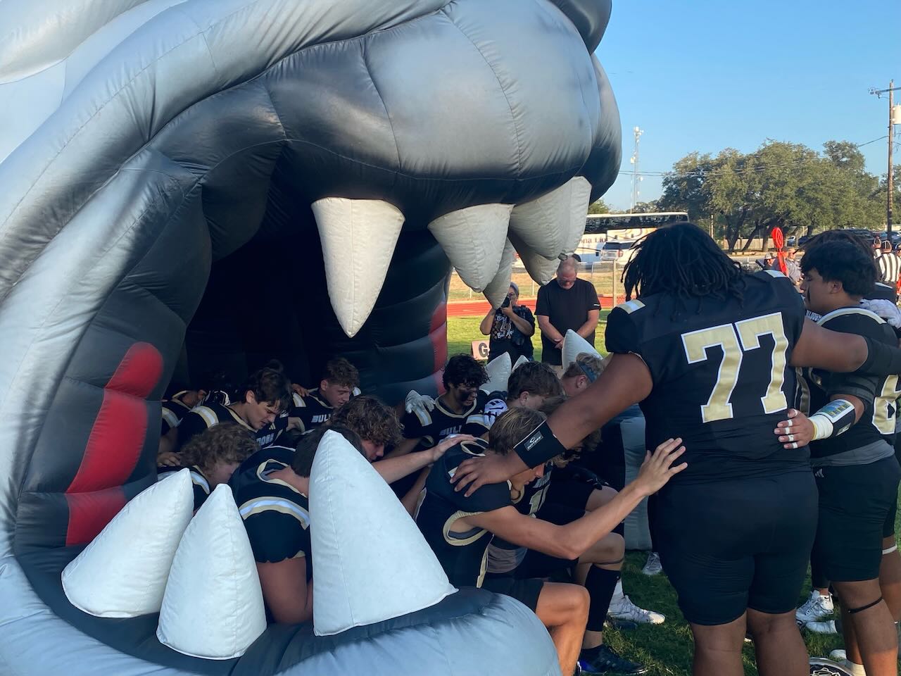 The Brady Bulldogs pray before the game against the Ozona Lions on Sept 12, 2025.