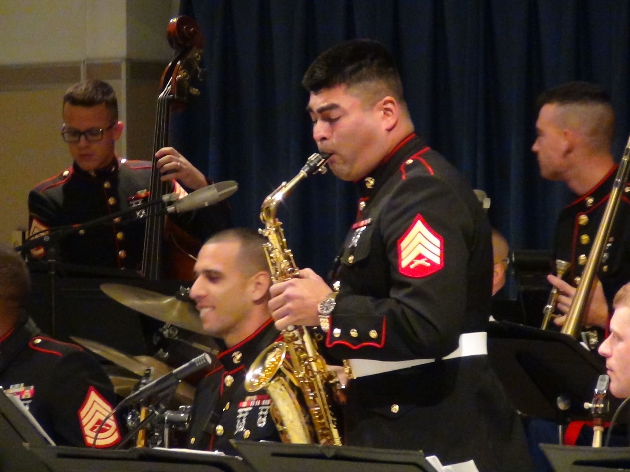 A marine sax player stands up for a solo (LIVE! photo by Cheyenne Benson)
