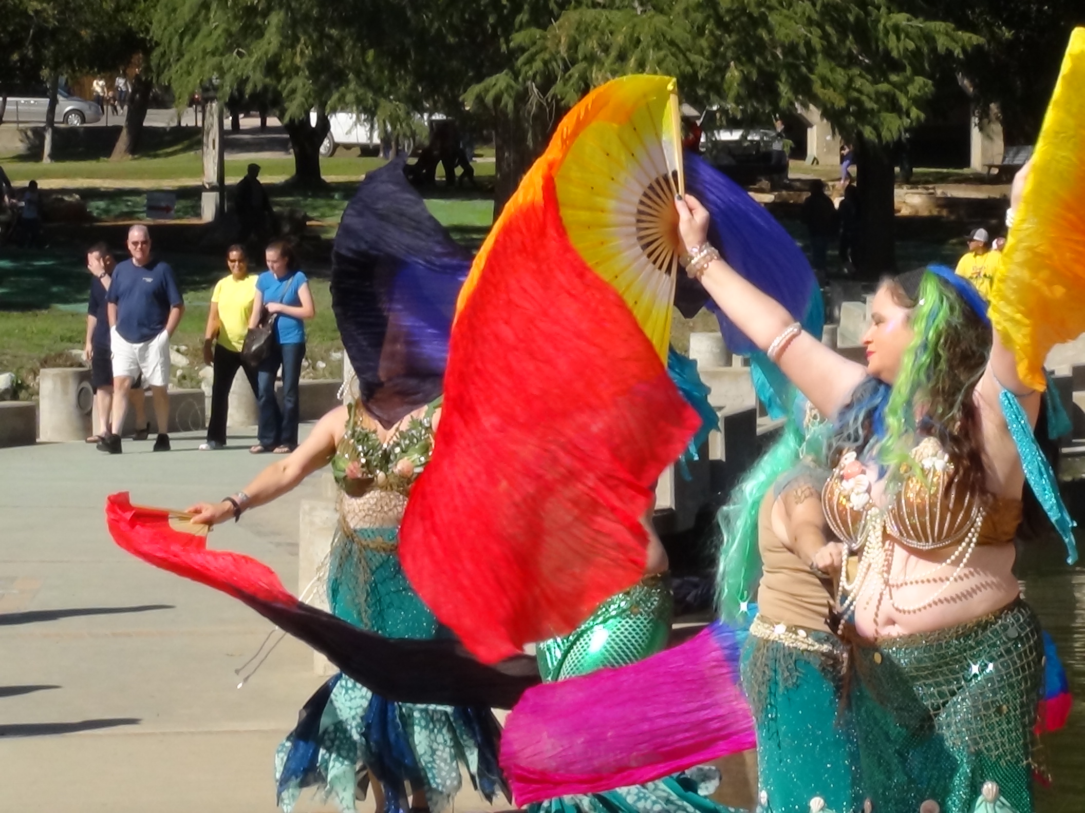 Raks Sanan Mermaids use flags for a colorful display (LIVE! photo by Cheyenne Benson)