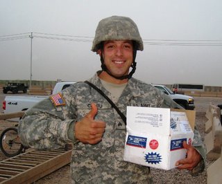 A soldier receives mail (photo courtesy of northwestmilitary.com)