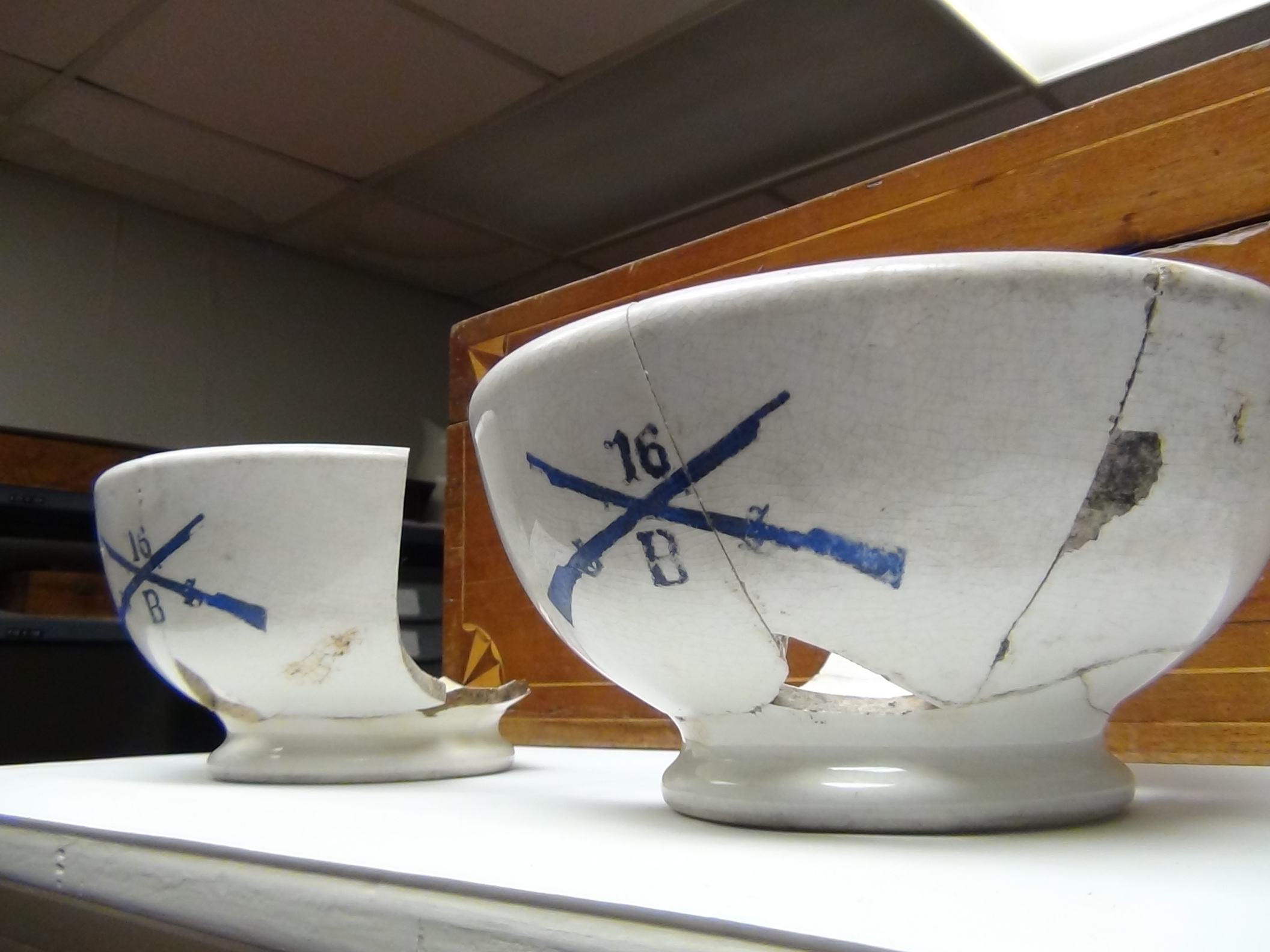 The two bowls were found in the trash dump and pieced together (LIVE! photo by Cheyenne Benson)