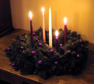 An Advent Wreath lays on a table (photo courtesy of blog.yanceyarrington.com)