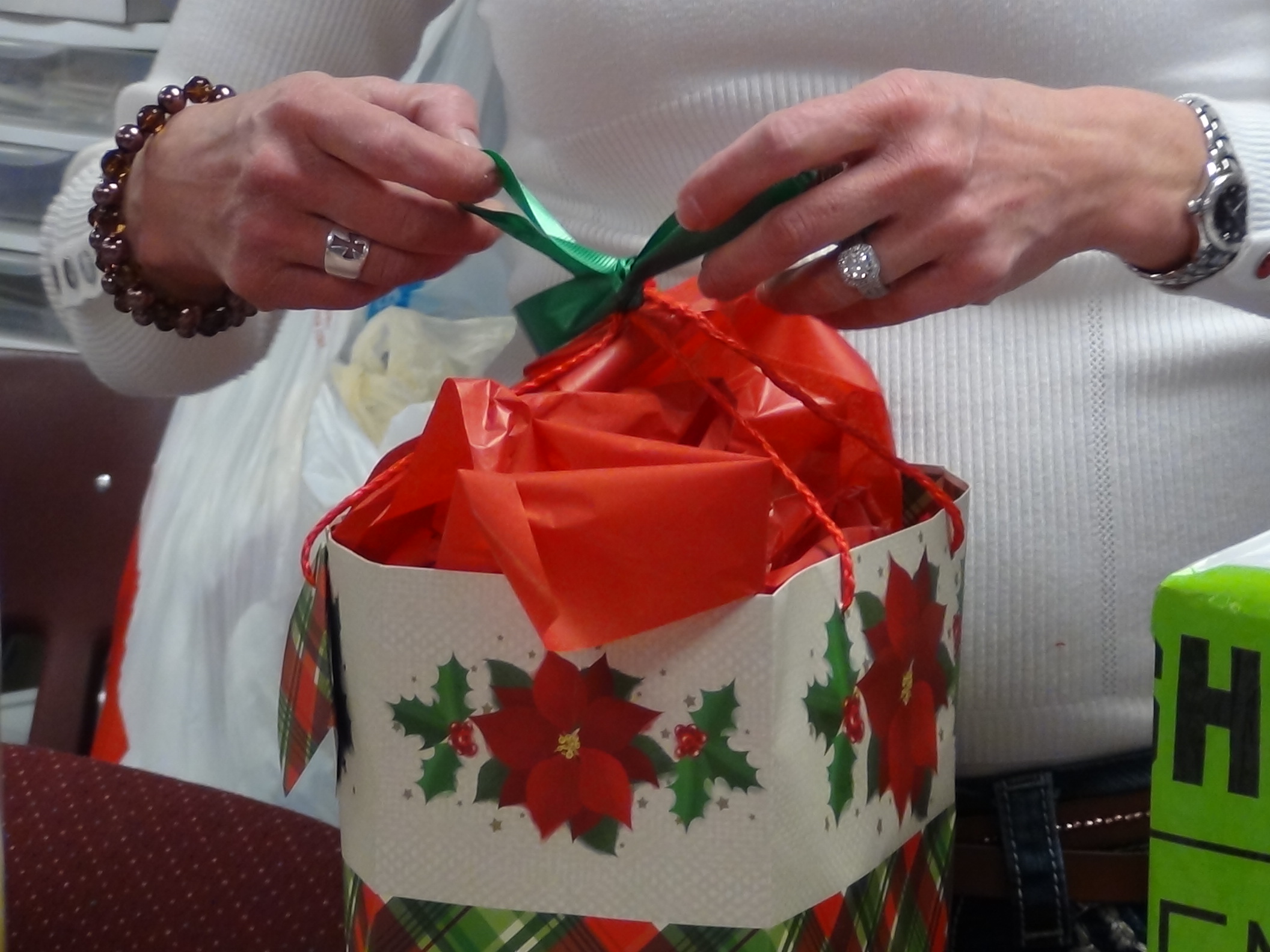 A volunteer wraps a gift (LIVE! photo by Cheyenne Benson)