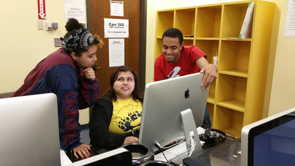 Graduating art majors Alexander Bryant and Ruth Cardenas (center) look over computer graphic design work with ASU student Lindsey Green. (Contributed Photo/Edwin Cuenco)
