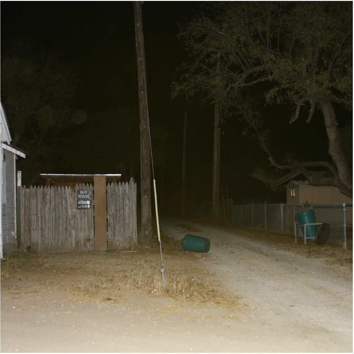 Juan Ibarra (left) was murdered in 2008. His case has since gone cold and detectives are seeking information. A possible suspect was seen speeding down the alleyway (right) in a maroon vehicle. (Photo Courtesy of SAPD)