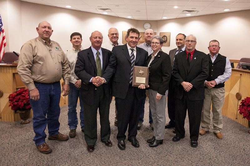 Apache Corporation employees and representatives of the Brazos Valley Groundwater Conservation District pose with the Mayor of College Station, Nancy Berry. (PRNewsFoto/Apache Corporation)