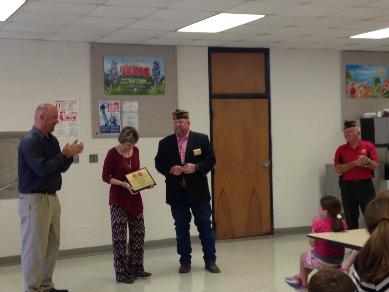 Teacher of the Year Laura Arthur is presented with her award from Wayne McShan. (LIVE! Photo/Chelsea Reinhard)