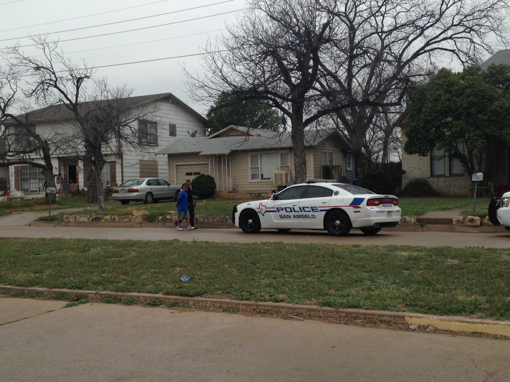 Officer Abel Nandin walks a juvenile to his patrol car, carrying a BB gun in the other hand on the 600 block of Preusser.