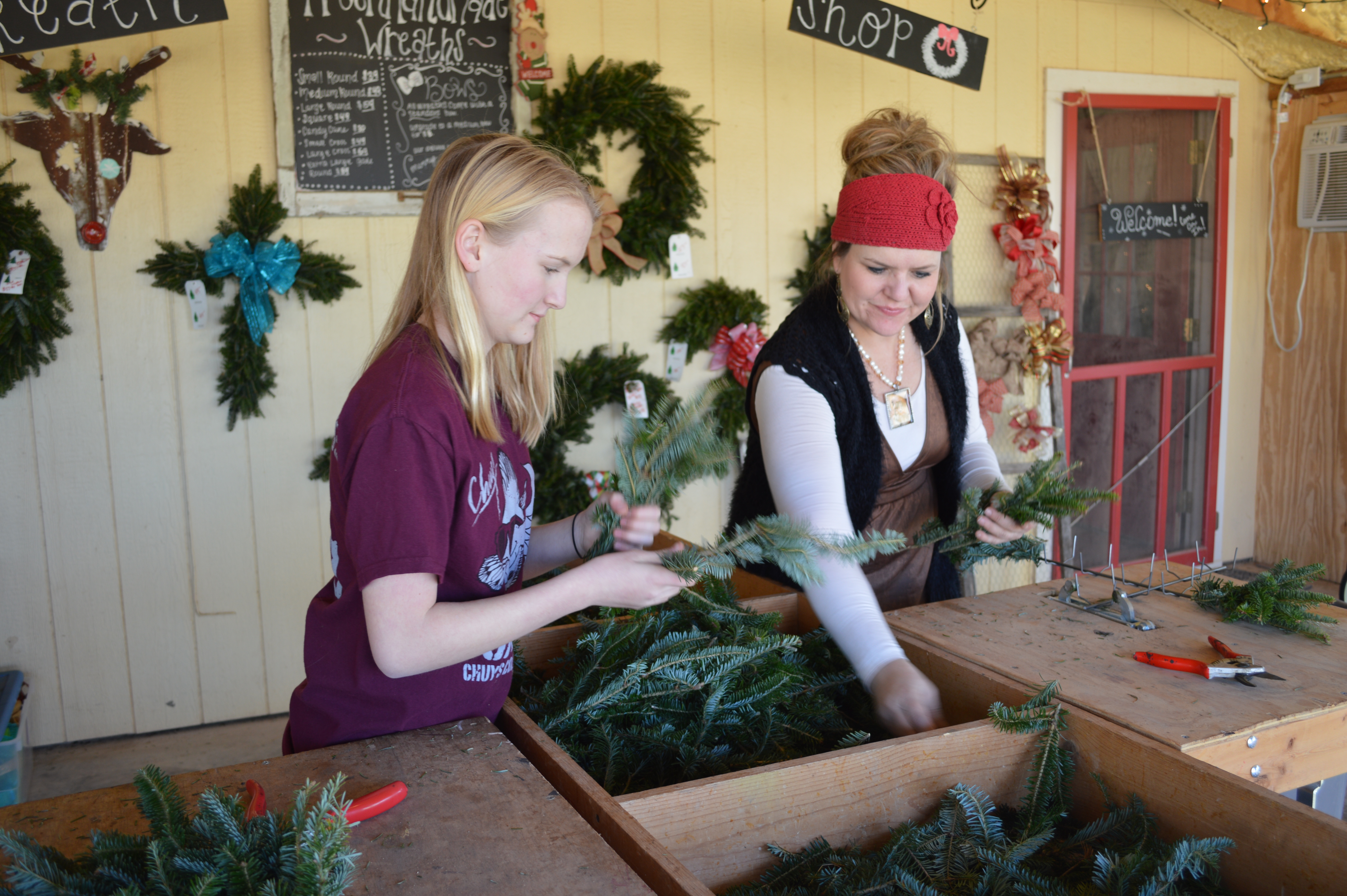 Jodie and Kenzie Uptergrove working in the wreath shop (LIVE! Photo by Lauren Lopez)