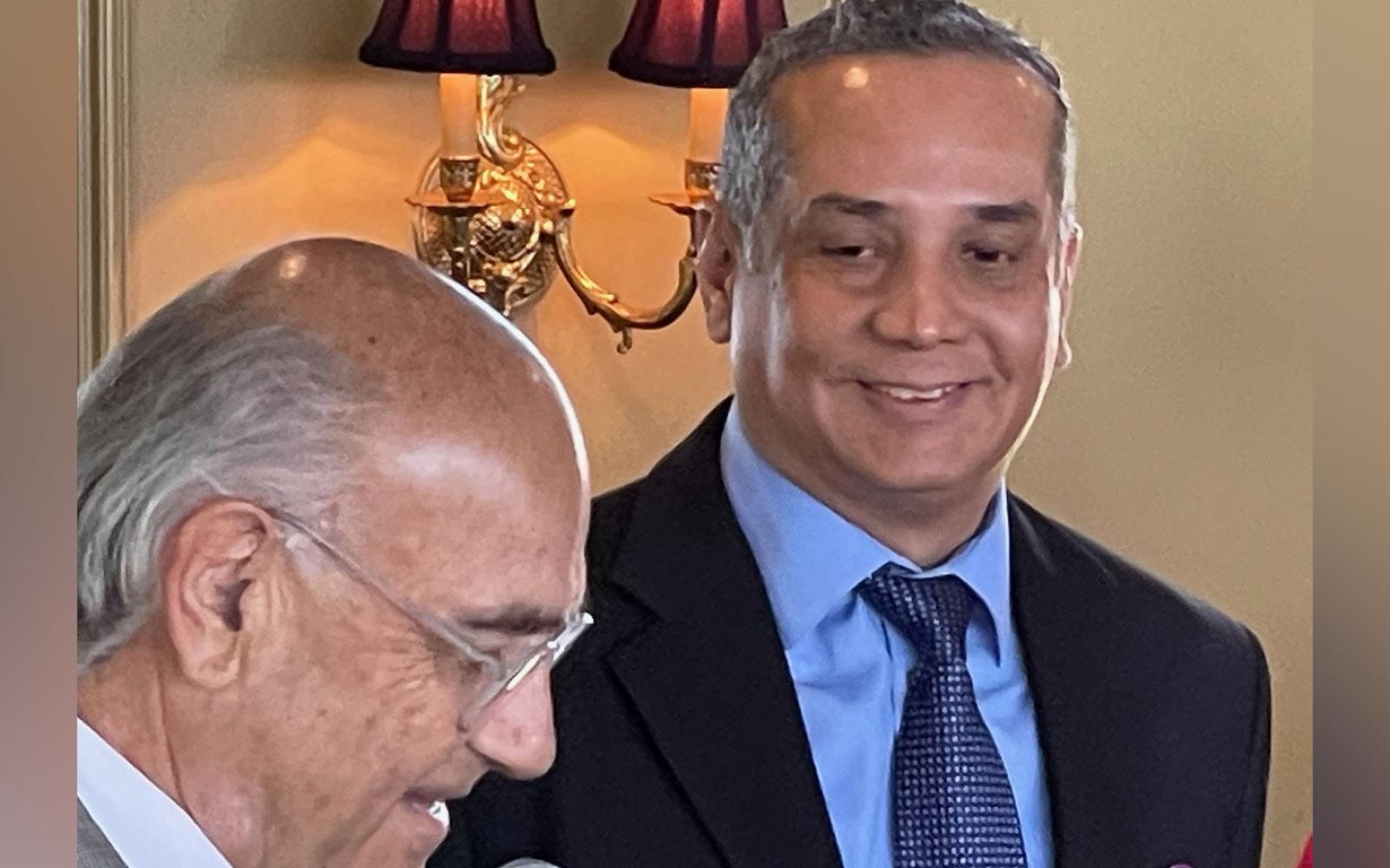 Francis Jelensperger (L) introduces the 2021-2022 President of the San Angelo Rotary Club, Hector Leos (R)