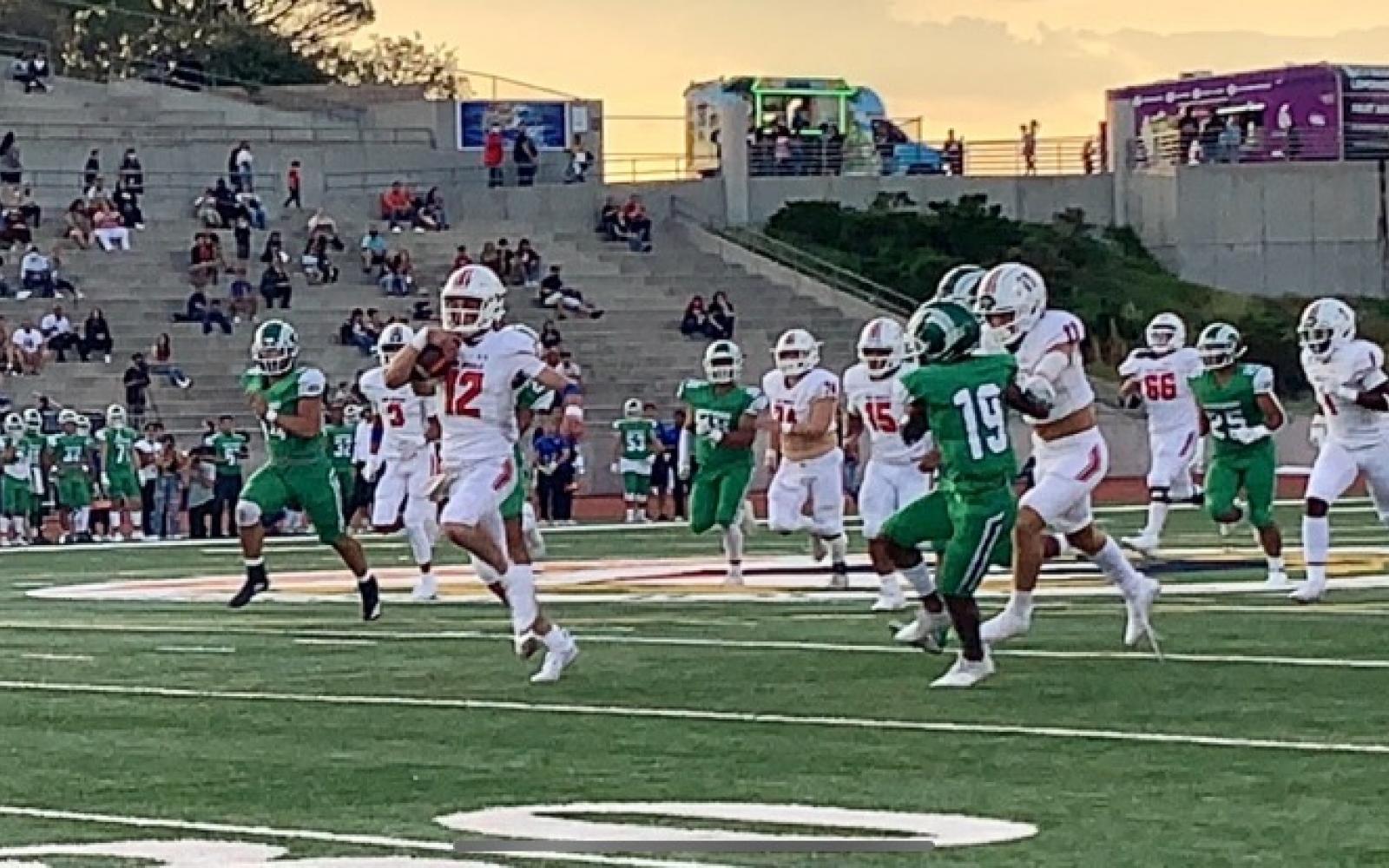 #12 QB1 Tyler Hill scores on a quarterback keeper against El Paso Montwood on Sept. 3, 2021.