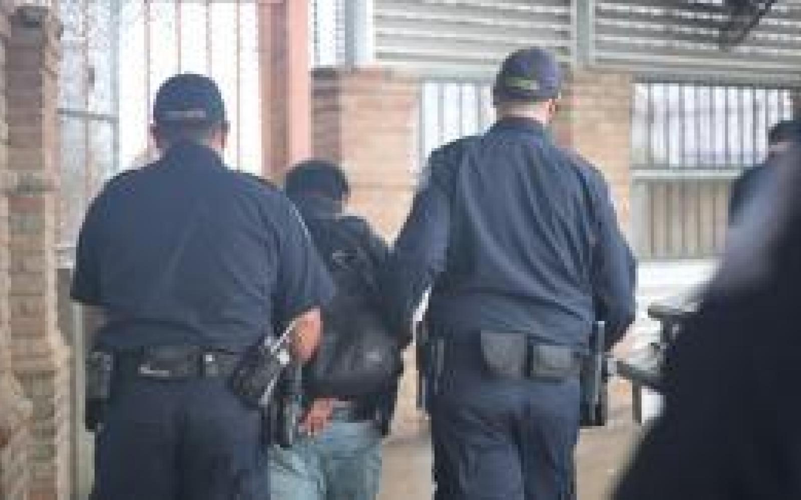 Suspect Escorted by CBP Officers (Contributed/CBP)