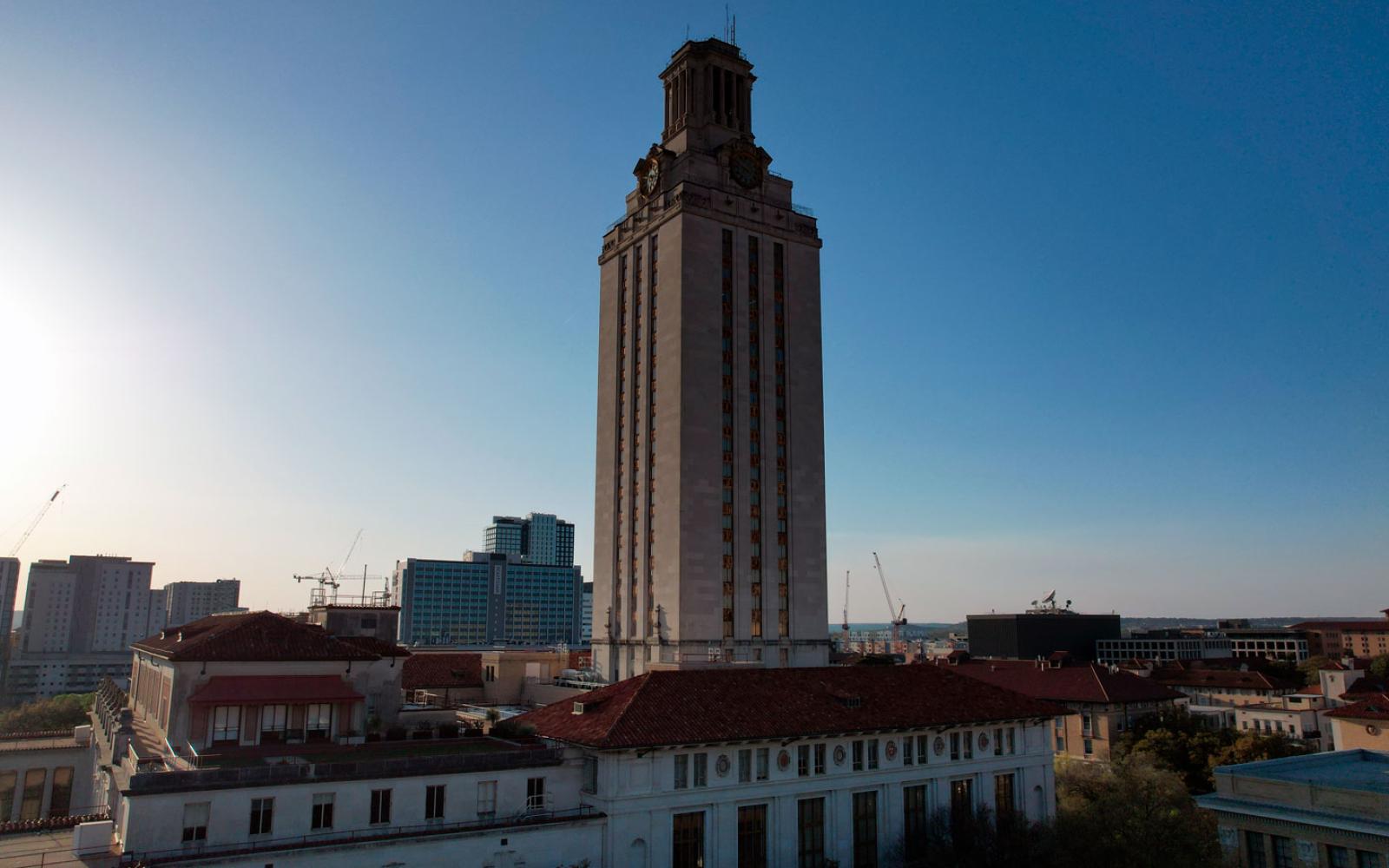 The UT Tower and Main Building on the University of Texas campus, Saturday, Mar. 26, 2022, in Austin. Tex. (Kirby Lee via AP)