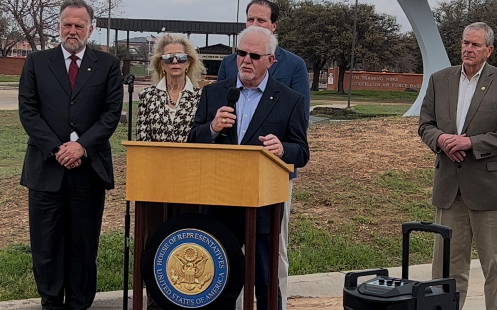 Chamber President Walt Koenig, Mayor Brenda Gunter, Congressman August Pfluger (back), banker Mike Boyd at podium and County Judge Steve Floyd.