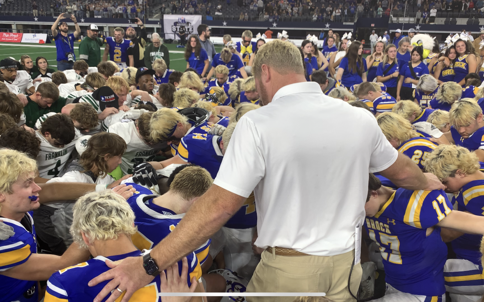 Coach Billy Mathis lets the Players lead Brock and Franklin in Prayer following the Championship Game