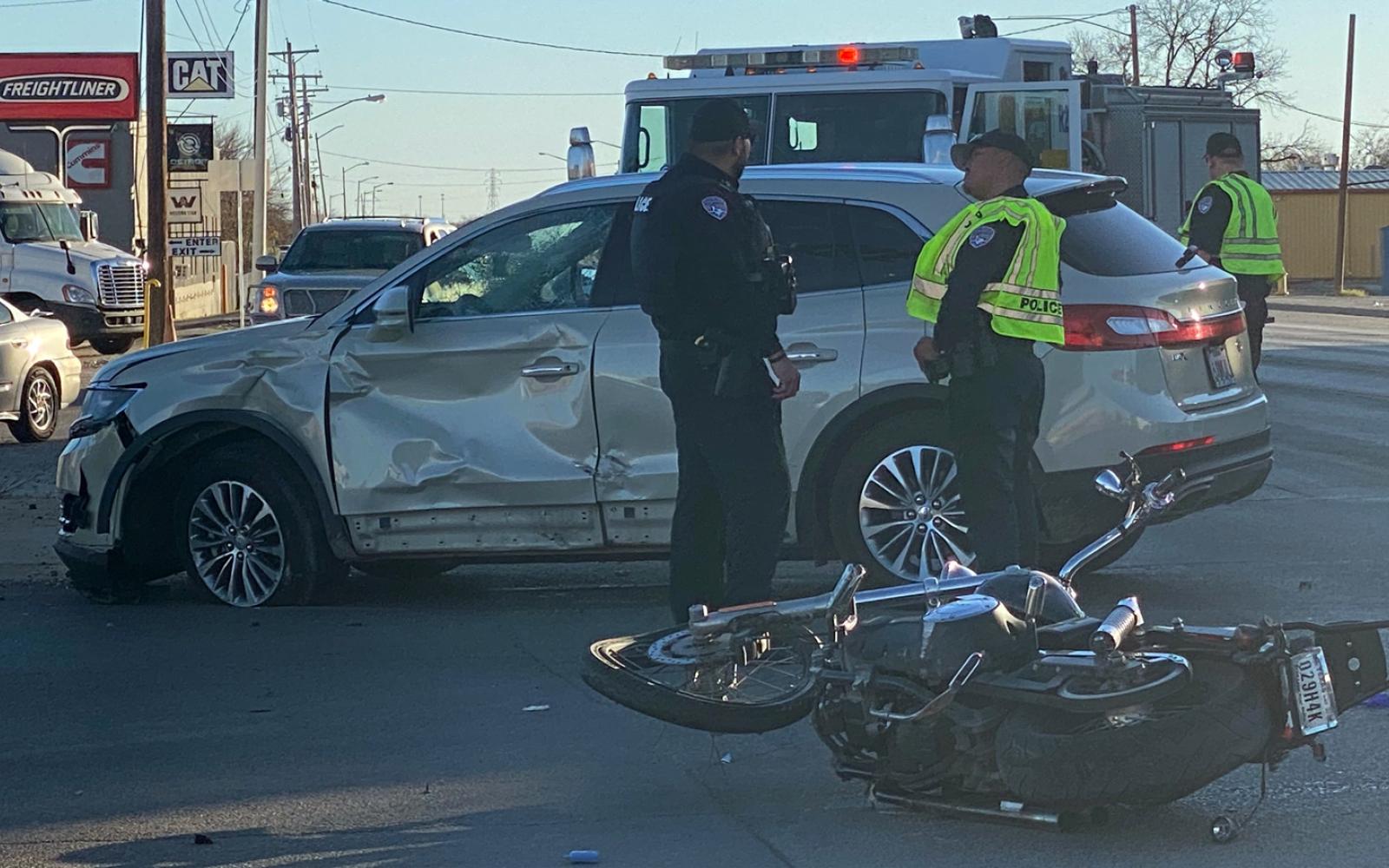 Damage to the car and the mangled motorcycle at crash scene in San Angelo on Dec. 31, 2023