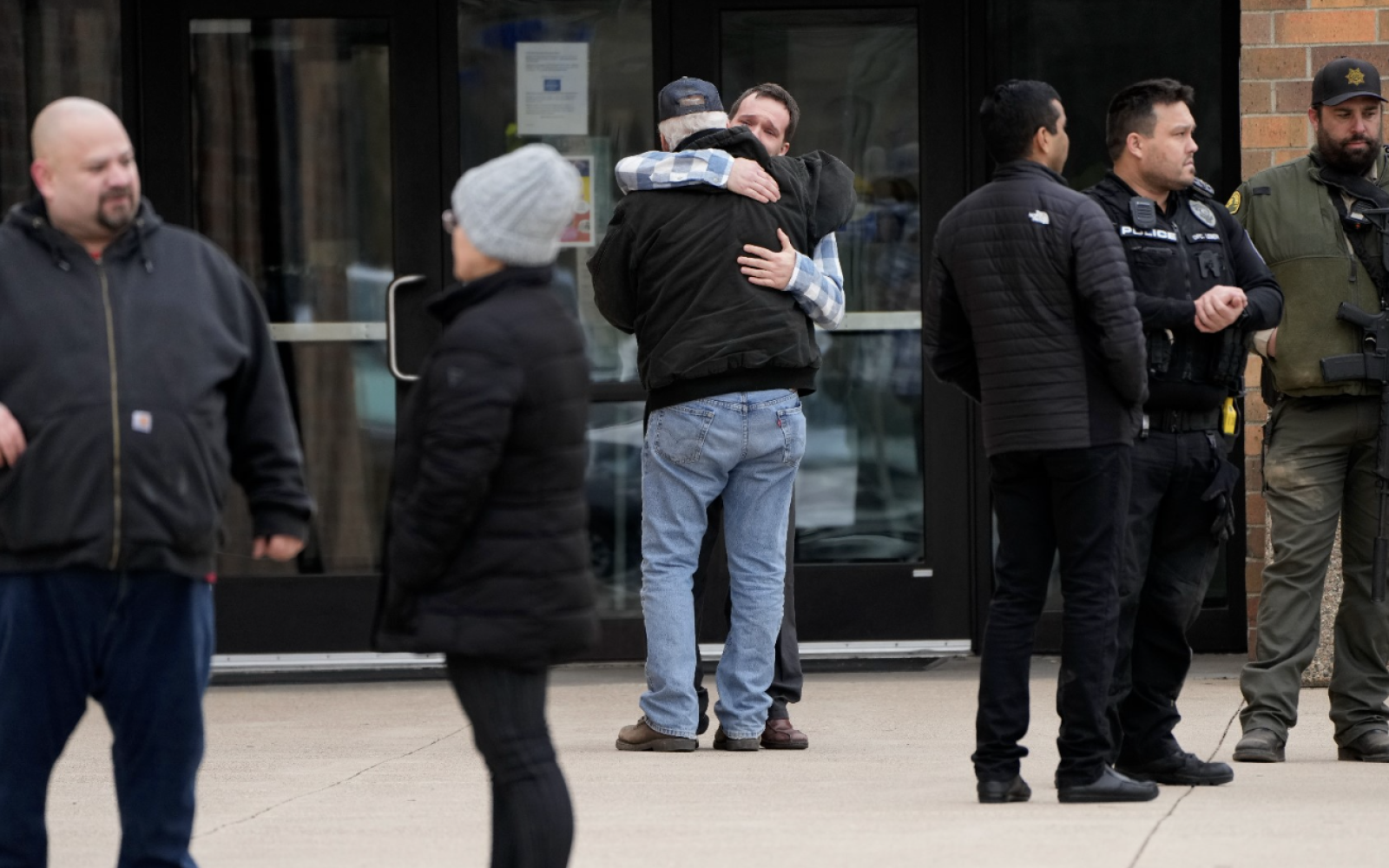 people embrace outside of school