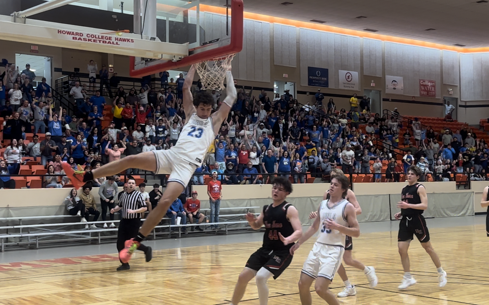 Reagan County's Kason Brown Slams Home the Basketball Against New Home