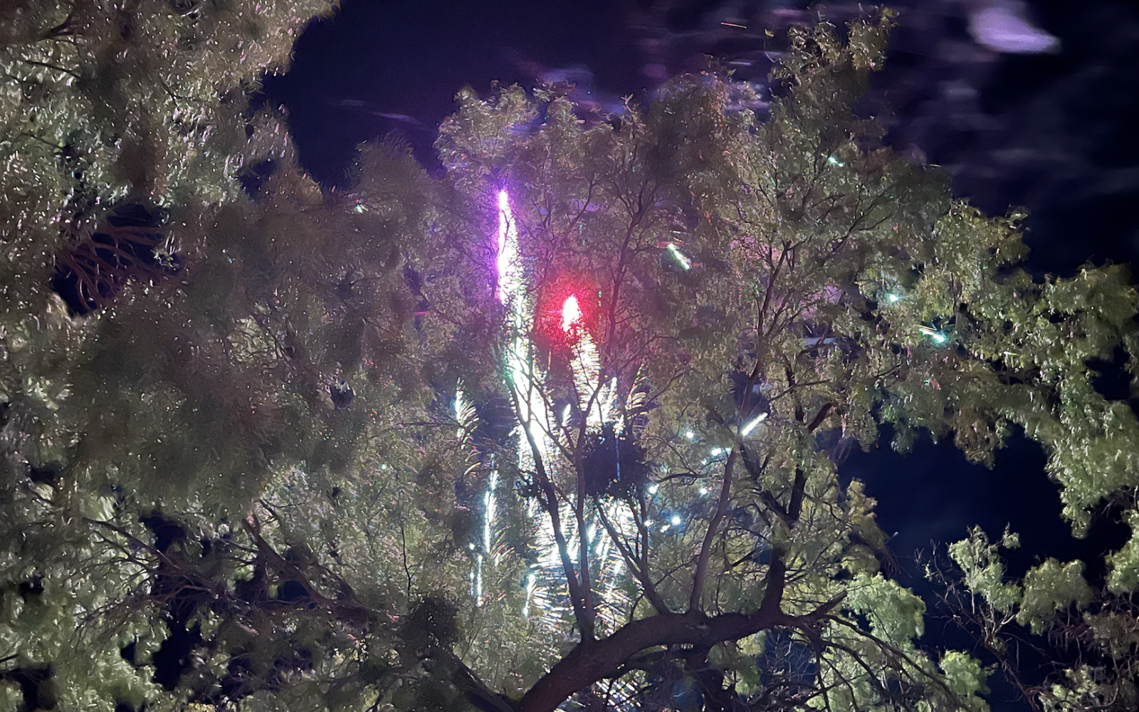 Individucals continued to set off fireworks as firefighters battled a grass fire.