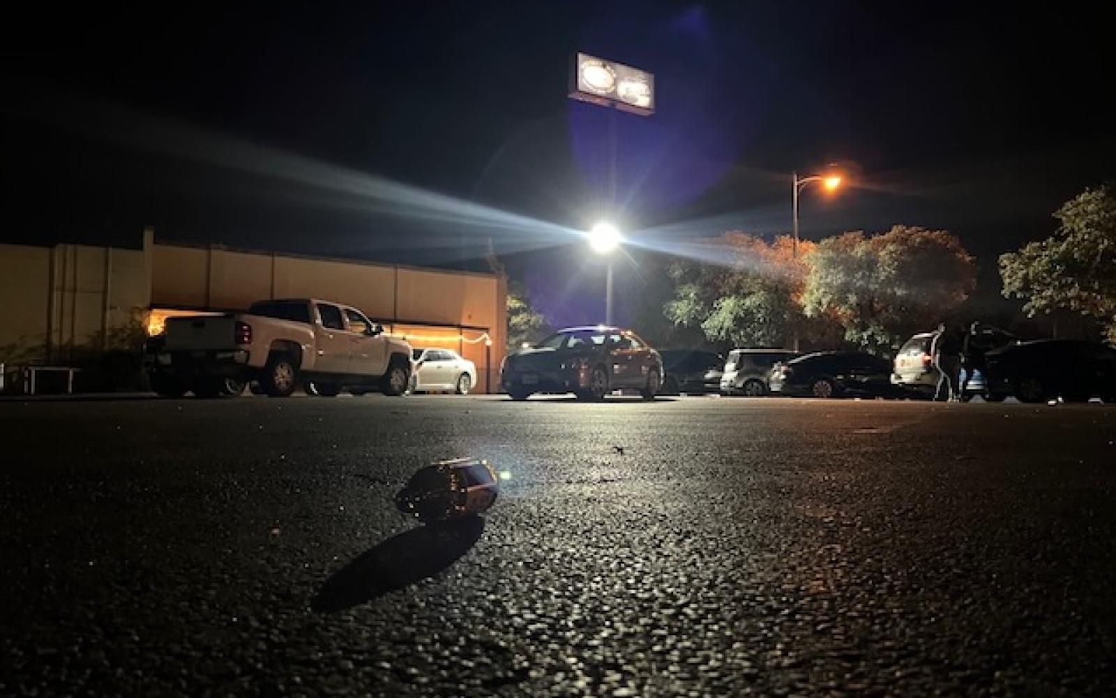 Empty beer bottles were scattered throughout the bar's parking lot, with at least 20 observed at the scene.