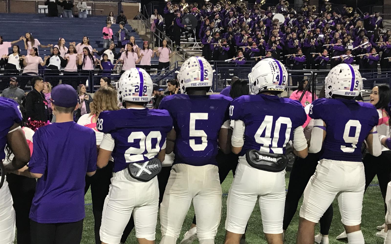 The Midland High Bulldogs listen to their band play the school song after their win over San Angelo Central on Friday, Oct. 25, 2024. Among them is Elijah McCoy (5), who had 354 rushing yards and seven touchdowns in the 56-47 win.