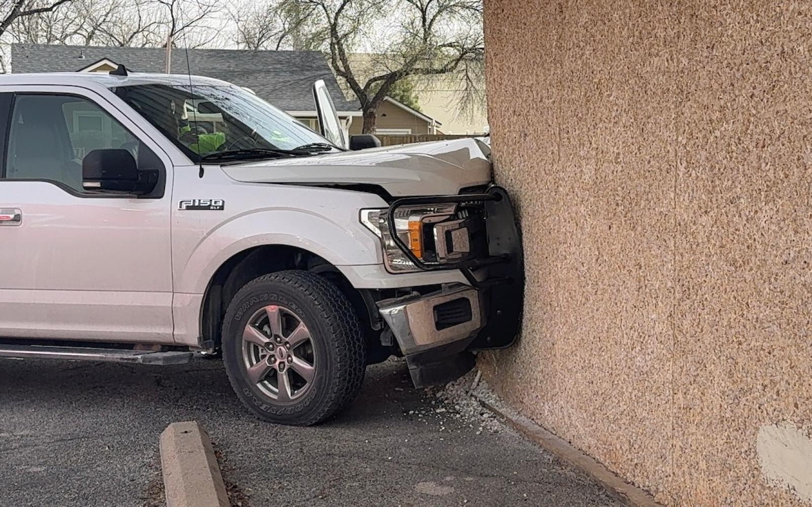The Ford F-150 that slammed into the building at Pecos and N Garrett St on March 12, 2025.