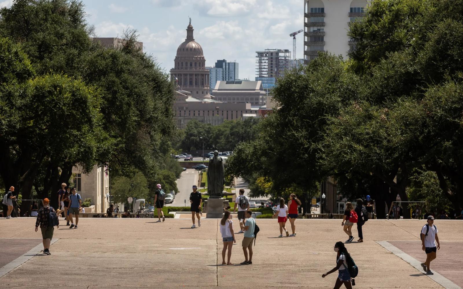 Students walk through campus at the University of Texas at Austin on Aug. 25, 2021.