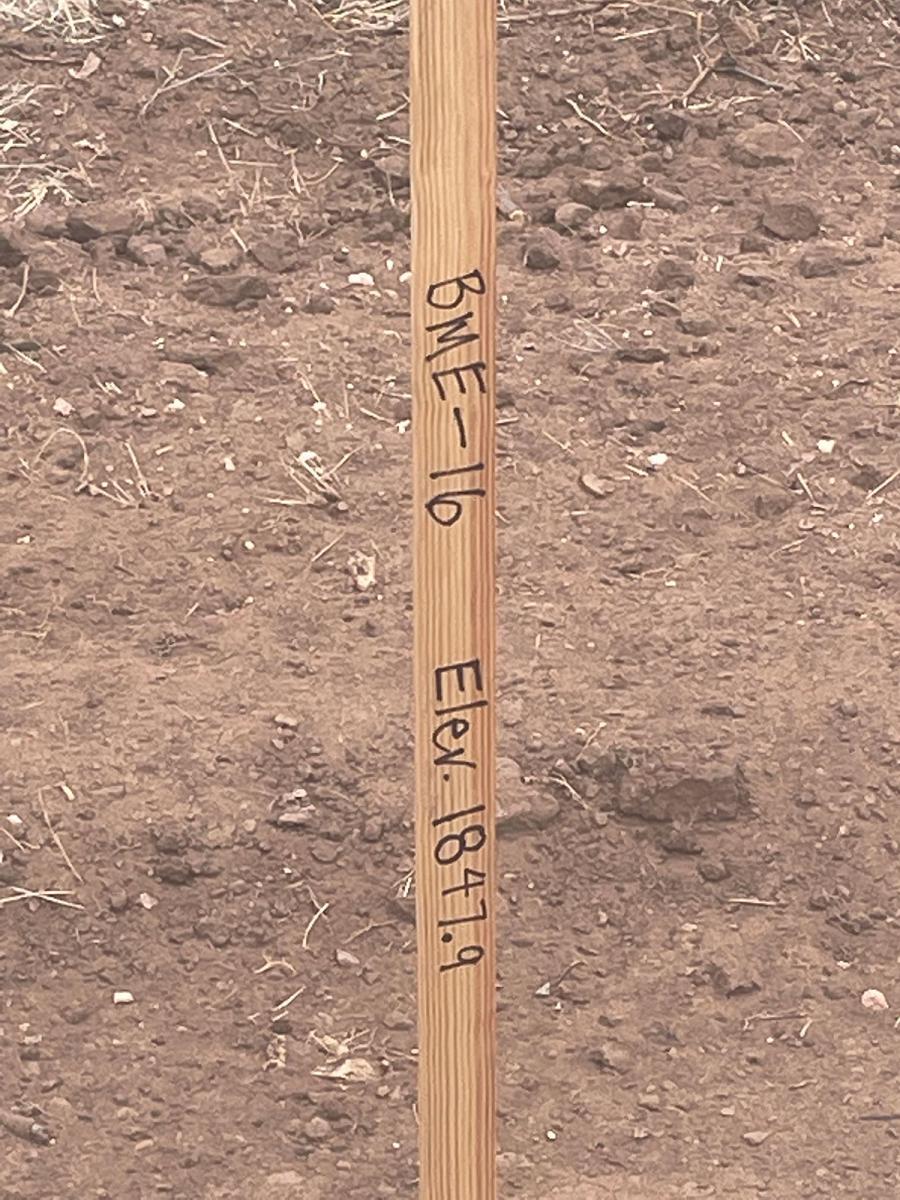 A leaked photo of stakes indicating a landfill study at the proposed new location is underway.
