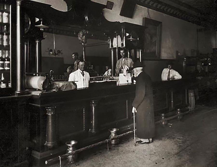 Mr. J. J. Callan: Irish immigrant, Georgetown graduate, Texas Ranger, Confederate veteran, settler in Menardville 1871 (year it was founded). Donated land for Catholic Church 1872. Instrumental in its construction in 1899. About 1910 at the Legal Tender Saloon. Mr. Callen is right of center facing the bar holding a cane.