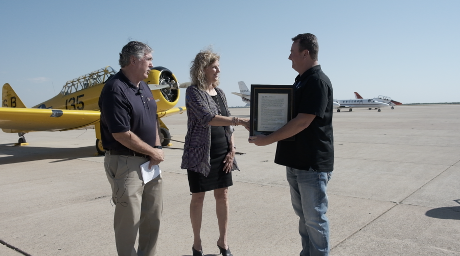 Kevin Long pictured on the right accepting his award