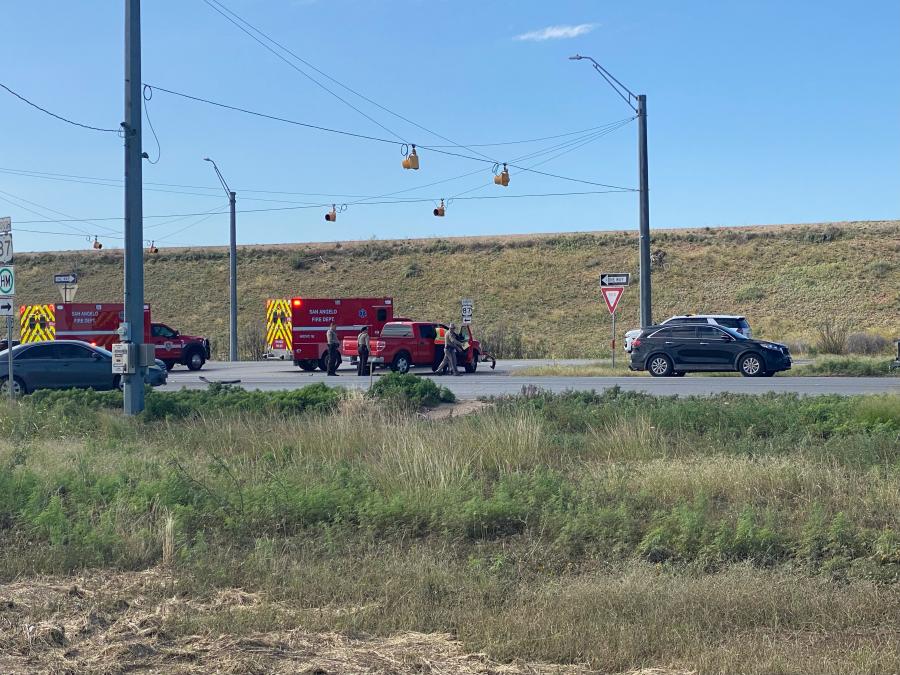Emergency responders from the San Angelo Fire Department and Texas DPS assess the scene at US-87 and FM 2105 following a two-vehicle crash on Monday morning. (Photo by San Angelo LIVE!)
