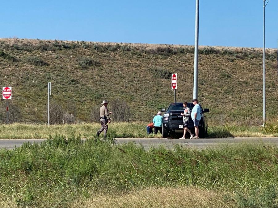 A Texas DPS trooper speaks with individuals involved in the crash near the intersection of US-87 and FM 2105. No injuries requiring hospital transport were reported. (Photo by San Angelo LIVE!)