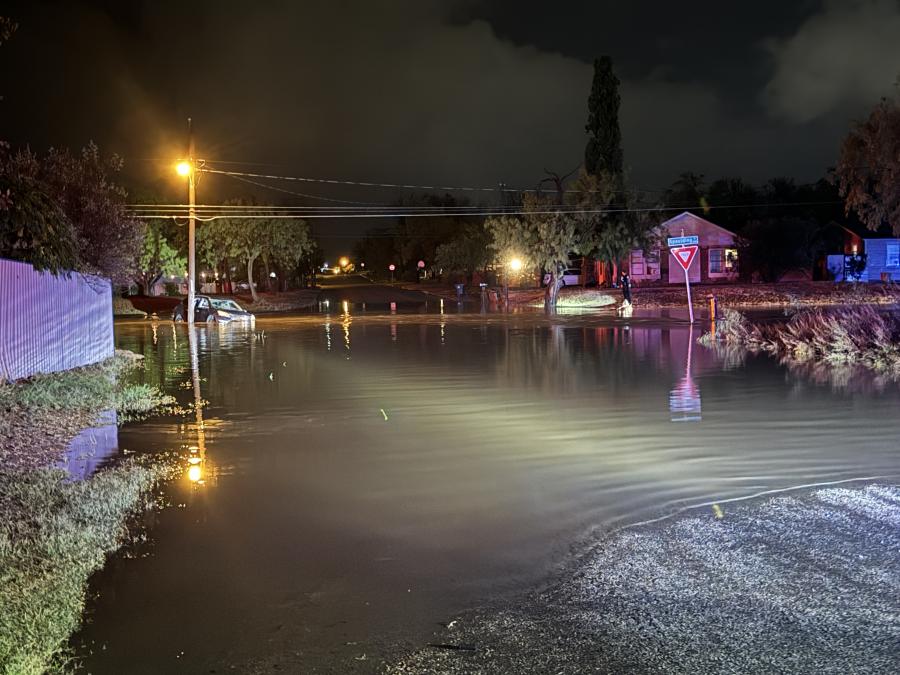 Floodwaters fill the intersection at Spaulding Street, creating hazardous conditions for drivers and prompting multiple rescues. San Angelo’s emergency teams worked through the night as heavy rainfall inundated low-lying areas.