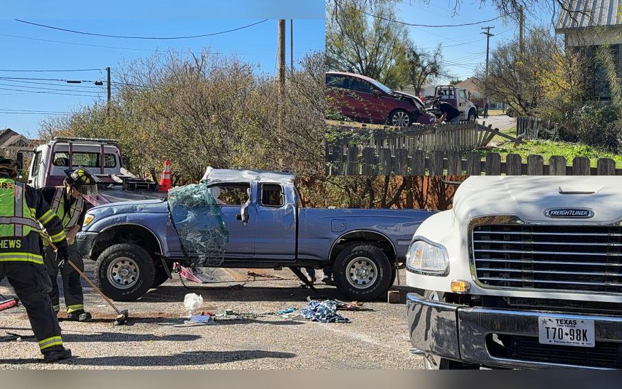 First responders assess the aftermath of a collision at the intersection of West Harris Avenue and North Jefferson Street in San Angelo. The crash caused a blue Toyota Tacoma to flip and sent a red Hyundai Sonata into a wooden picket fence. No injuries were reported.