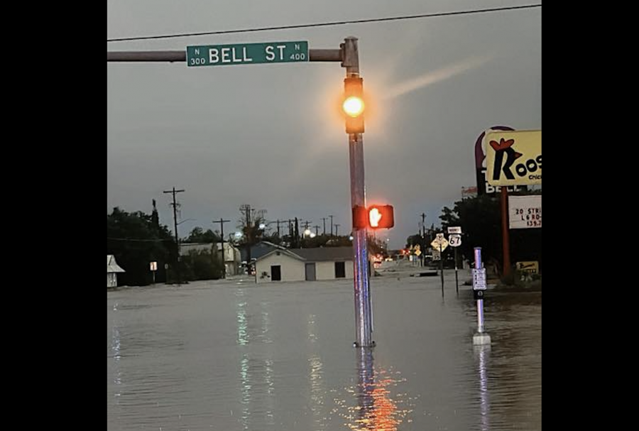 A structure is shown floating down Pulliam Street after heavy flooding in San Angelo on Friday, July 4, 2025.