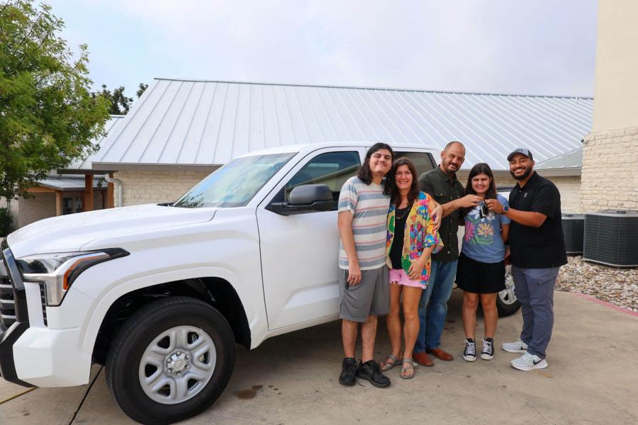 THE MERTZ FAMILY GATHERED OUTSIDE KERRVILLE BIBLE CHURCH LAST WEEK TO RECEIVE A NEW CAR FROM SAMARITAN’S PURSE AFTER LOSING THEIRS IN THE FLOOD.