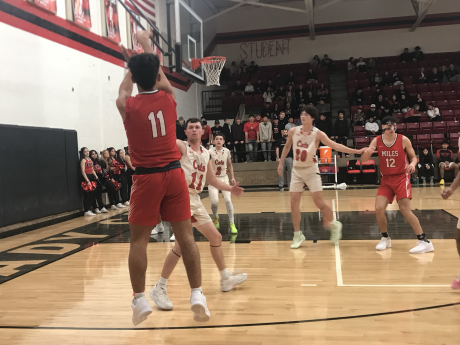Miles' Caleb Guzman knocks down one of his five 3-pointers Wednesday against Ballinger.