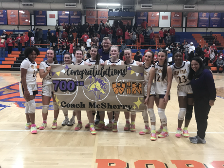 The Ozona girls basketball team celebrates after their bidistrict playoff win over Ballinger, which was the 700th career victory for head coach Jerry McSherry.
