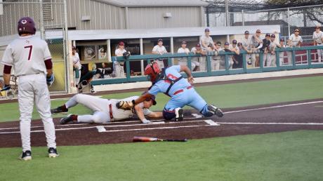 Calallen's baseball team tries to score a run during the 2026 season.