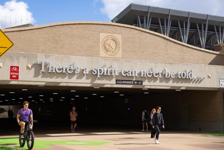 Students walk through a tunnel under Wellborn Road on the Texas A&M University campus in College Station on Nov. 13, 2025.