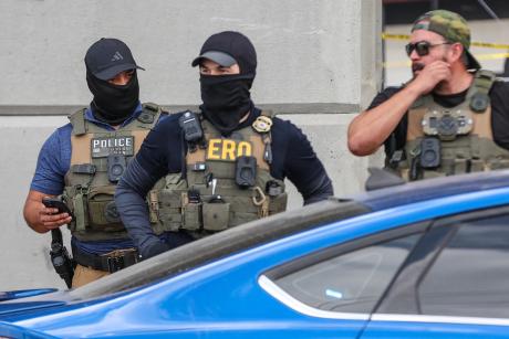 Immigration and Customs Enforcement agents in North Austin after a person was shot earlier on Sunday, Sept. 20, 2026.