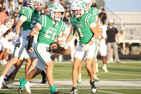 Wall's Krue Thompson celebrates with Christian Camp (1) and Blaize Benson (5) against Ozona on Friday, Sept. 18, 2026.